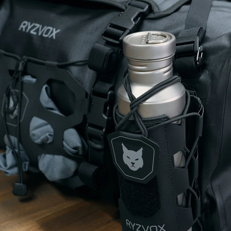 RYZVOX FAR Duffel Bag 40L Moto, front view with the lynx crest on the front panel