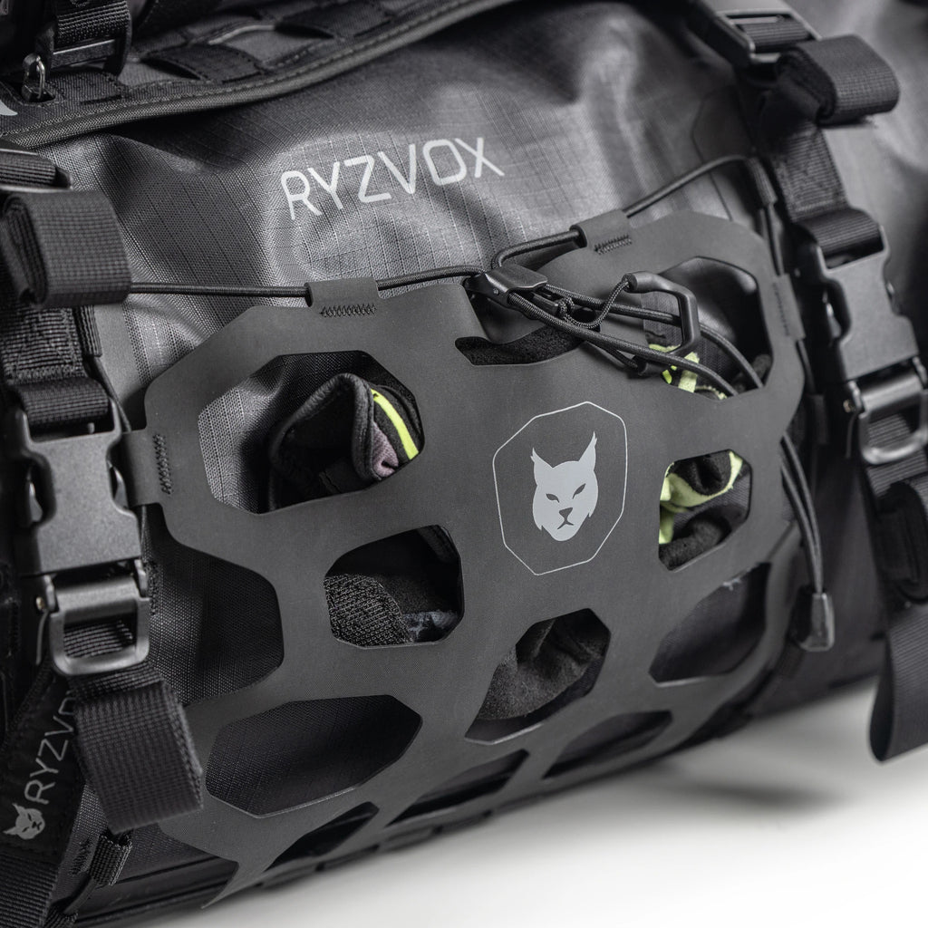 Close up of the front panel with the lynx crest and the elastic cargo net