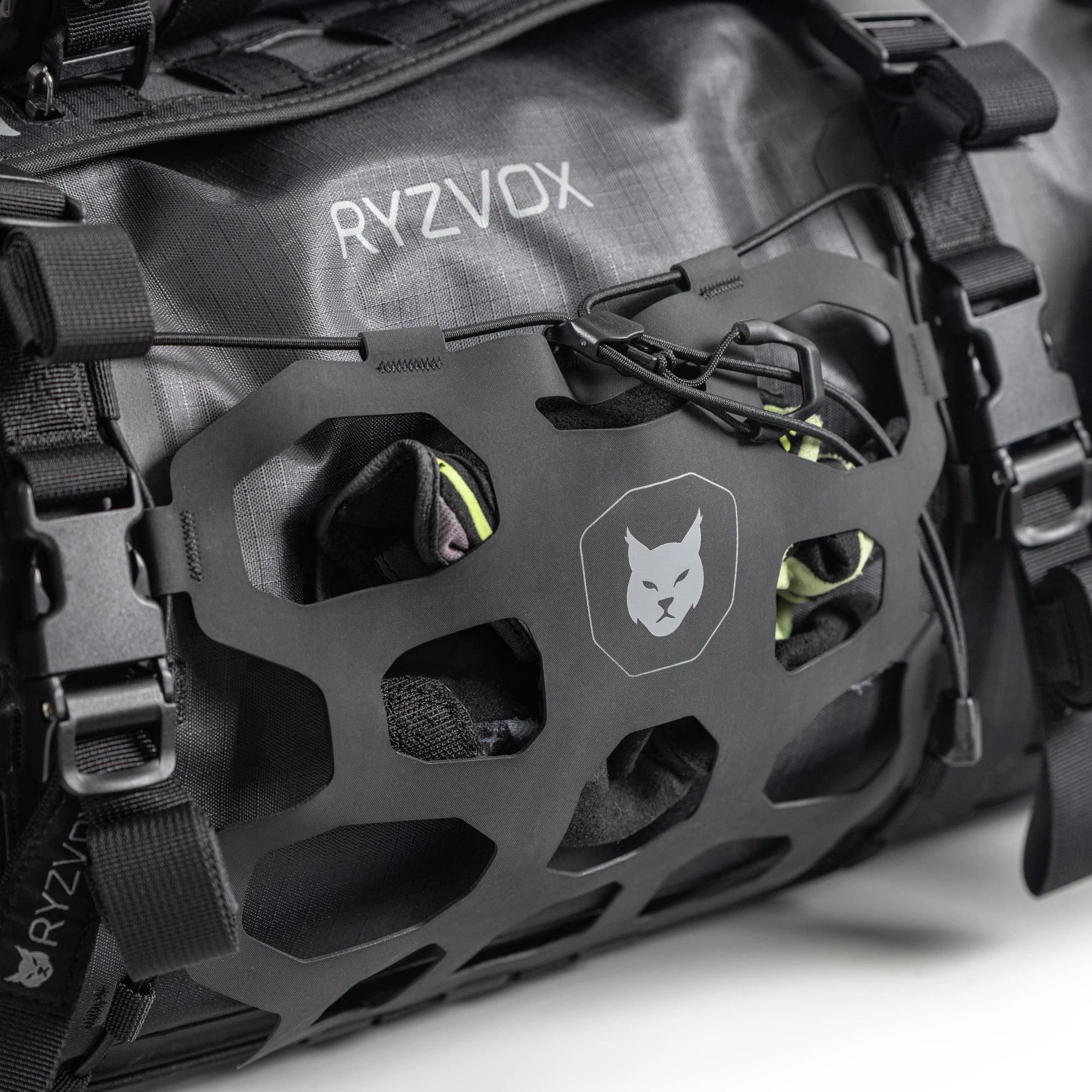 Close up of the front panel with the lynx crest and the elastic cargo net
