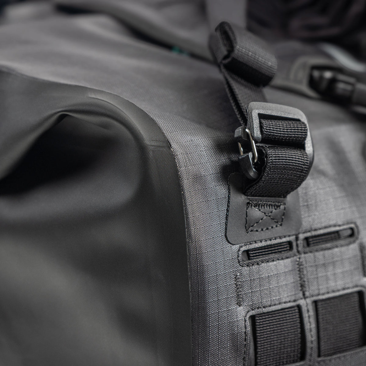 Close up of a reinforced corner and a strap buckle