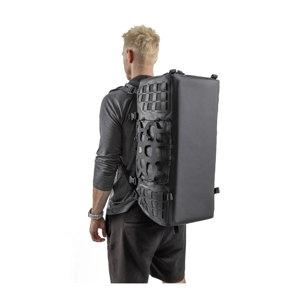 Man wearing the RYZVOX FAR Duffel Bag 40L Travel as a backpack, seen from behind