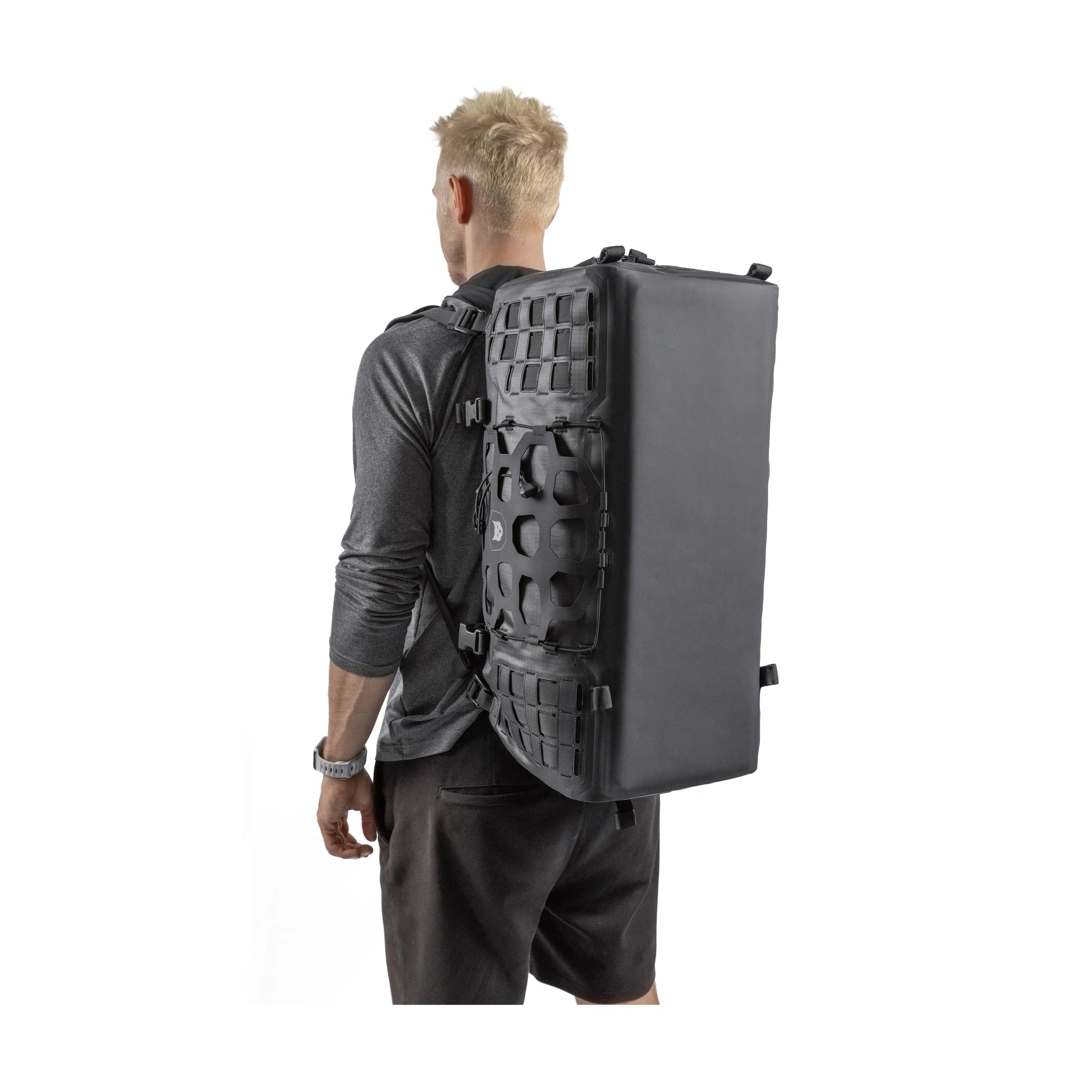 Man wearing the RYZVOX FAR Duffel Bag 40L Travel as a backpack, seen from behind