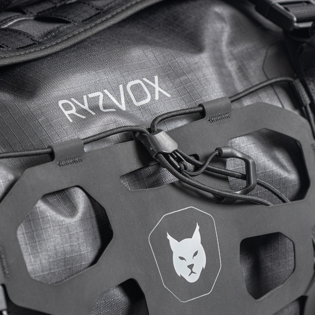 Close up of the front panel with the lynx crest and the elastic cargo net