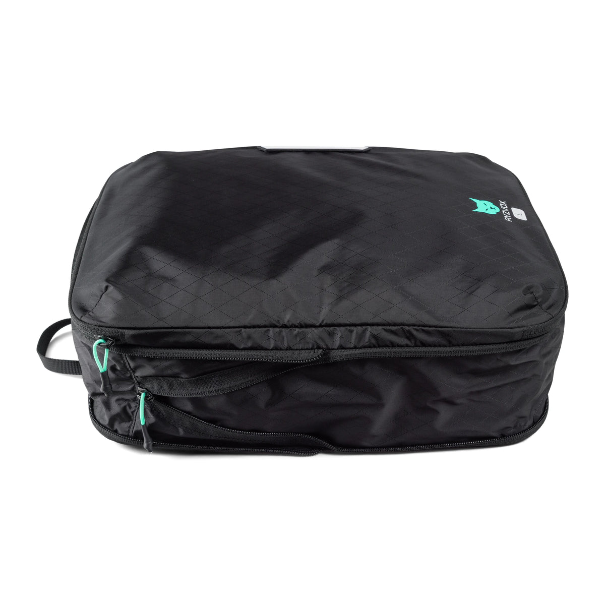 RYZVOX Packing Cube L packed full, seen from the front with the compression zip along the side