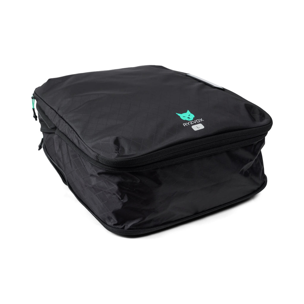 RYZVOX Packing Cube L packed full, seen from a three quarter angle