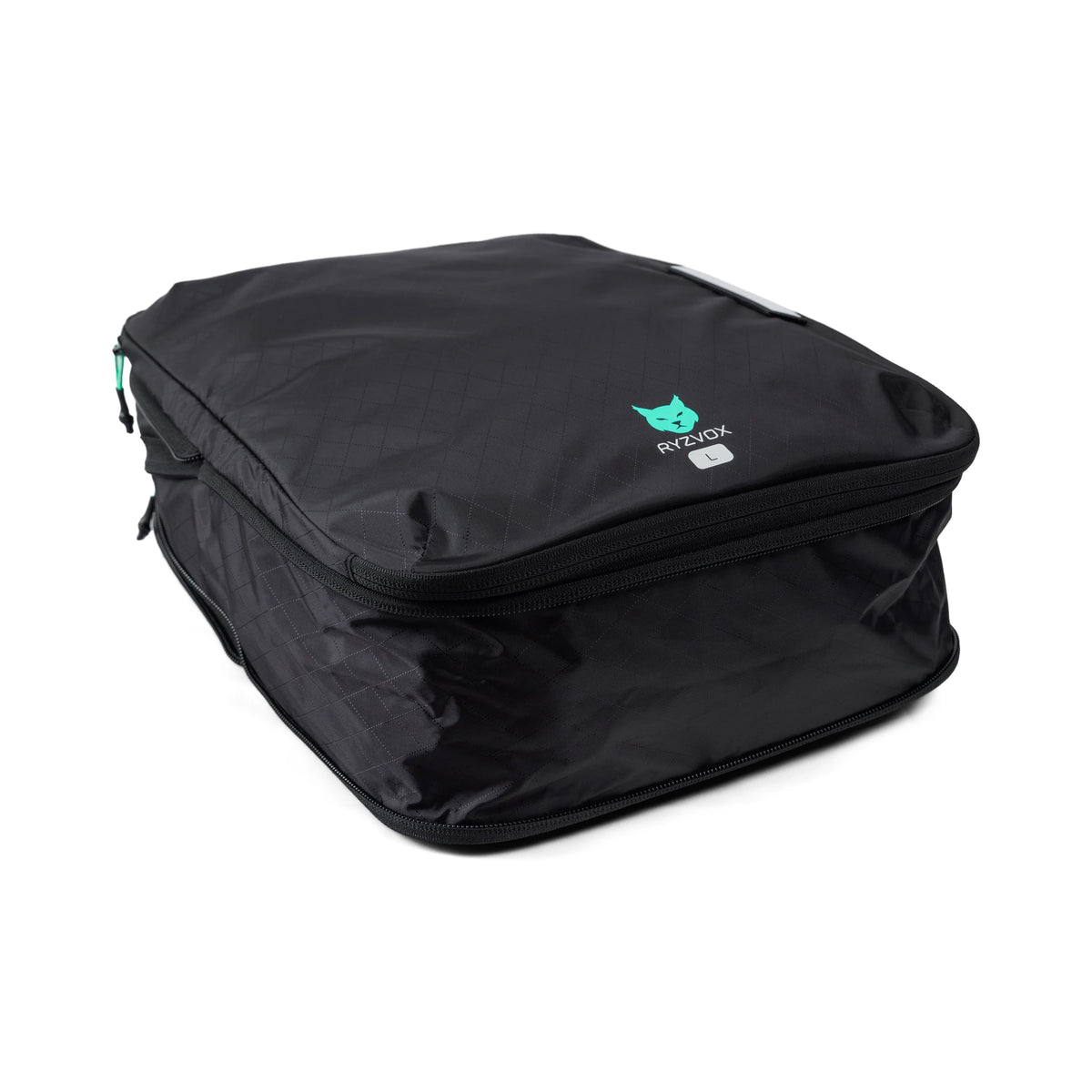 RYZVOX Packing Cube L packed full, seen from a three quarter angle