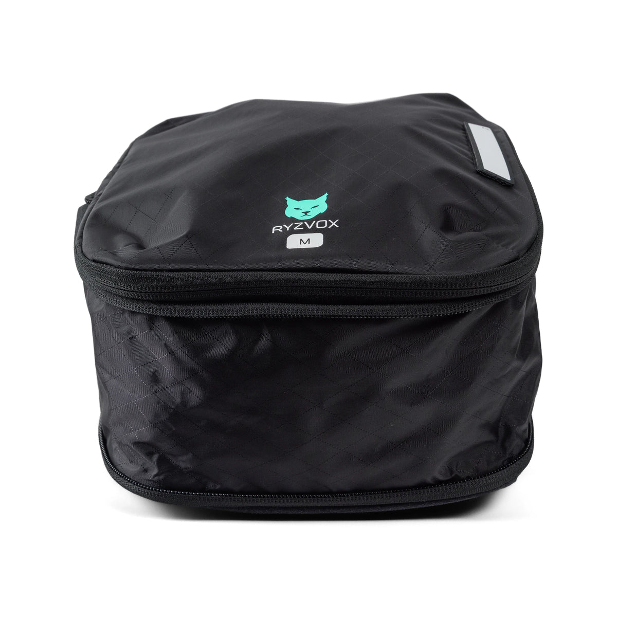 RYZVOX Packing Cube M packed full, with the size label on the front panel
