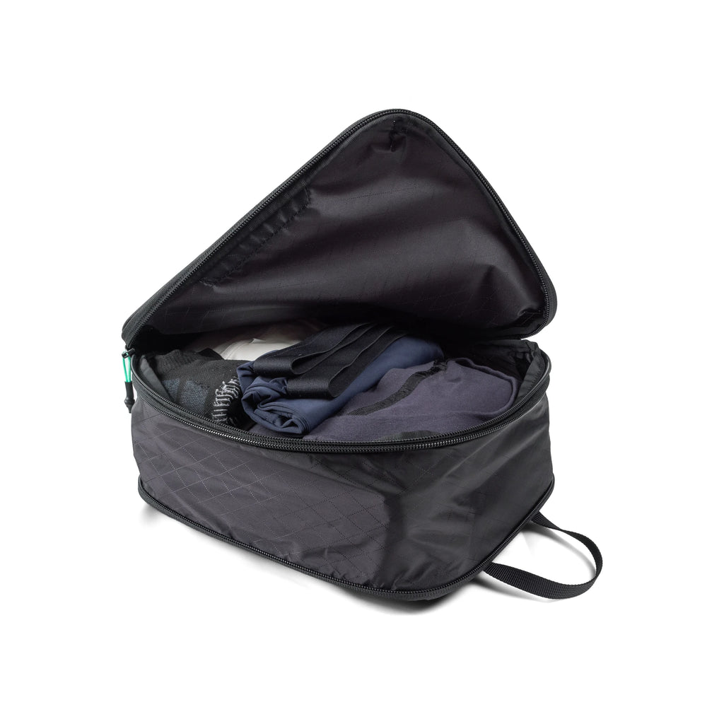 RYZVOX Packing Cube M open, showing folded clothing packed inside