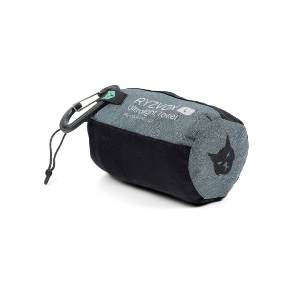 RYZVOX Ultralight Towel L in its stuff sack on its side with the carabiner attached