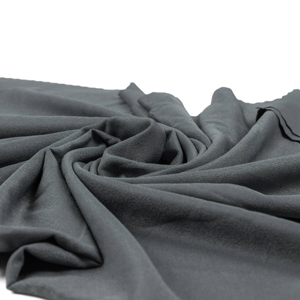 Grey nano fibre fabric of the RYZVOX Ultralight Towel L draped in soft folds